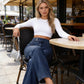 👖 MOST 30%-OS KEDVEZMÉNY! ✨ Magas derekú, széles szárú farmer – Aszimmetrikus részlet, rugalmas derékrész & vintage mosás – Előnyös és könnyedén elegáns 🧵